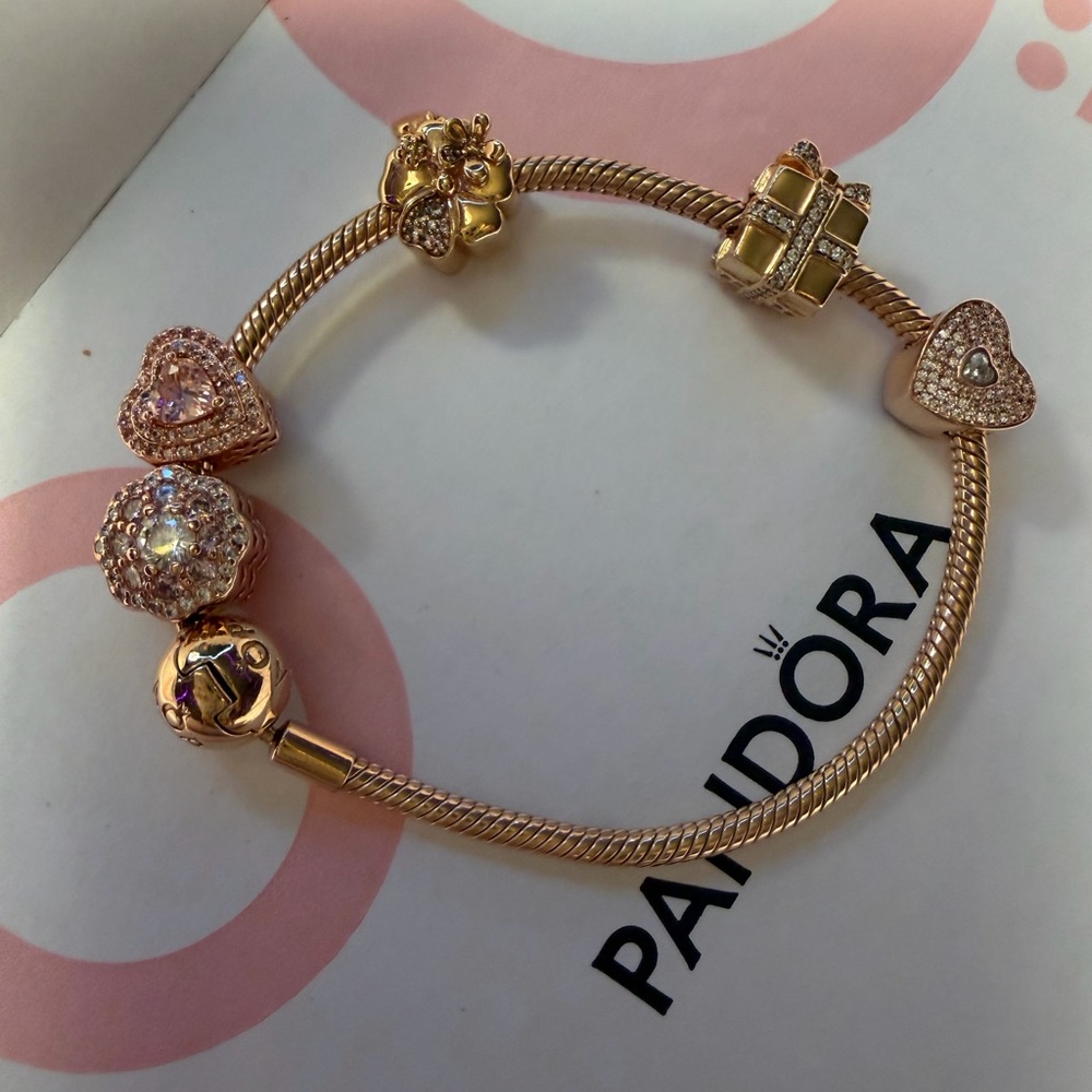 Pandora Rose Gold Charm Bracelet with charms